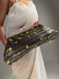 Black and gold kiss-clip oversized clutch with coin charms”

“Handcrafted black evening bag with gold detailing by Clutch It”

“Noir Royale oversized metallic clutch for weddings and events