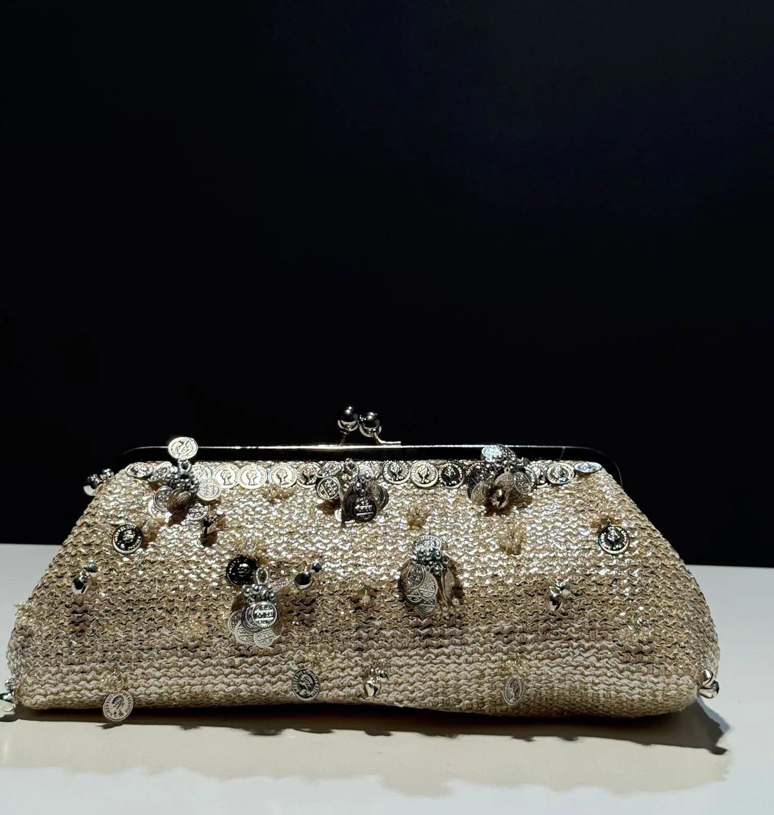 Champagne gold kiss-clip oversized evening clutch with coin charms”

“Handcrafted holiday clutch bag in metallic gold for weddings and galas”

“Aurora Kiss-Clip Clutch – festive statement accessory by Clutch It Handbags